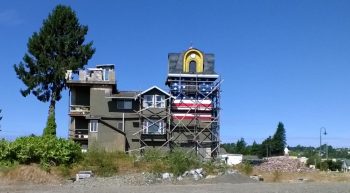 clock tower building showing new exterior treatment on exposed plywood 2015-06-18