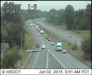 person trapped in car under fallen light pole