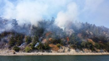 Portage Island fire on southern end - Photo credit-- Patti Evich