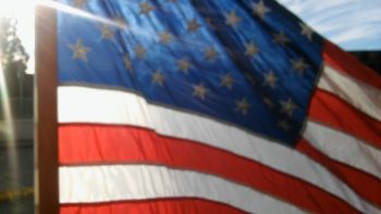 Flag waving over Main Street in Ferndale. Photo: Whatcom News