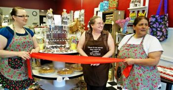 checkered apron ribbon cutting 2016-04-23