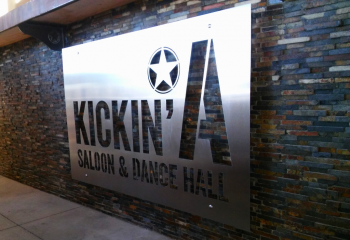 kickina saloon and dance hall interior sign
