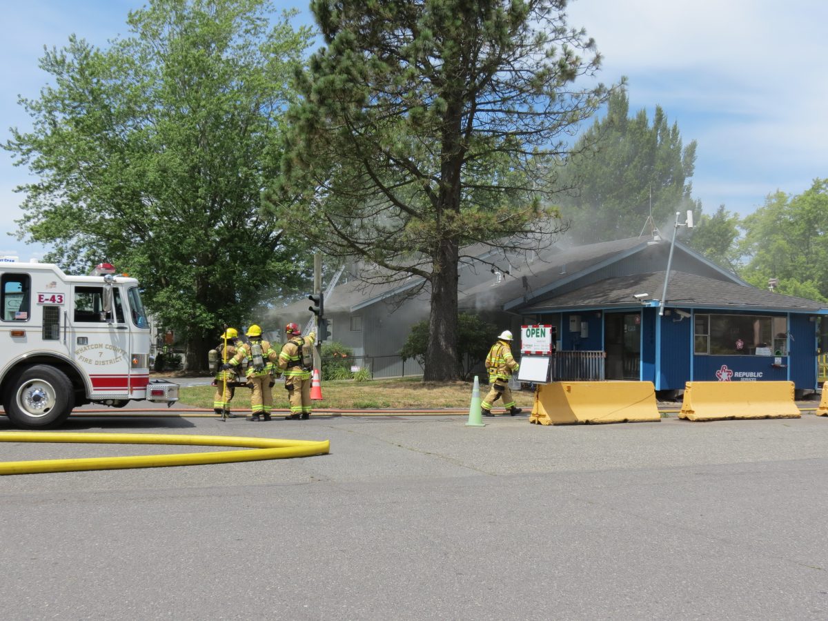 Republic Services offices smolder while firefighters attack an attic fire June 20, 2016. Photo: Discover Ferndale