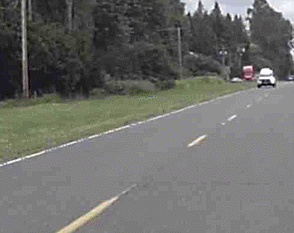 sheriff with lights driving by