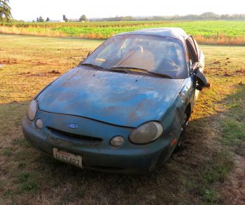 car into house on northwest drive uprighted car