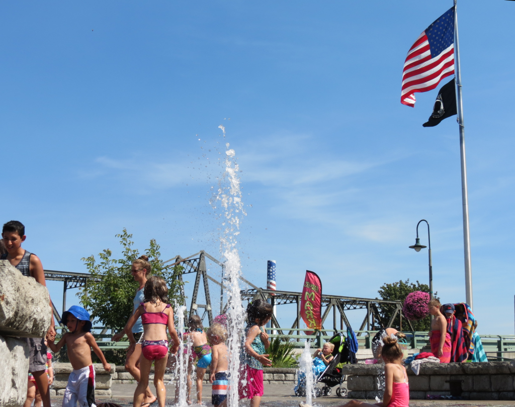 Kids playing in the fountain at Centennial Riverwalk Park in 90-degree weather (August 19, 2016). Photo: Discover Ferndale
