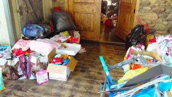 donations piled on landing for family displaced by fire 2016-12-21 janell neever