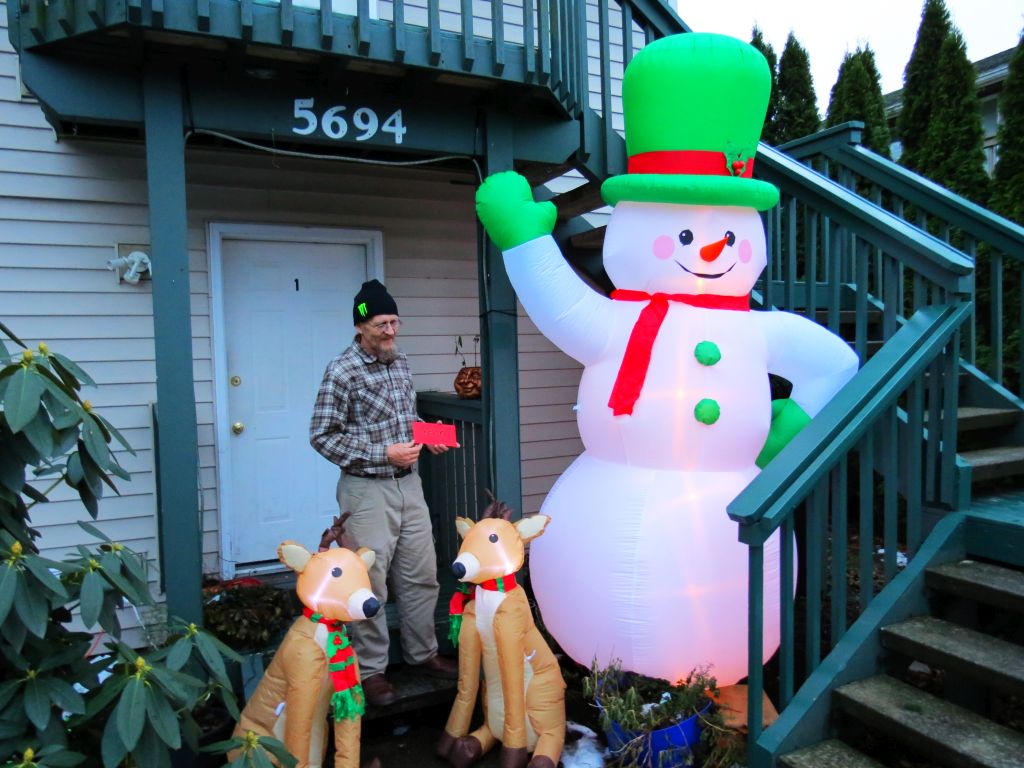 roy homan stands with inflatables given to him after his had been taken 2016-12-19
