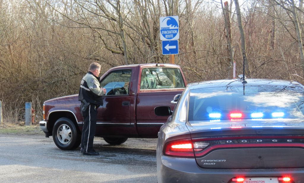 Whatcom County Sheriff's Office Deputy Kevin McFadden talks with a driver pulled over on a road closed due to flooding (February 17, 2017). Photo: My Ferndale News