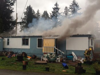 Scene of a mobile home on fire in the 6100 block of Portal Way 2017-04-13 photo FPD ofcr steve gamage
