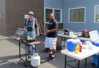 Mel Hanson and Derrick Watson have plenty of hot dogs ready for volunteers