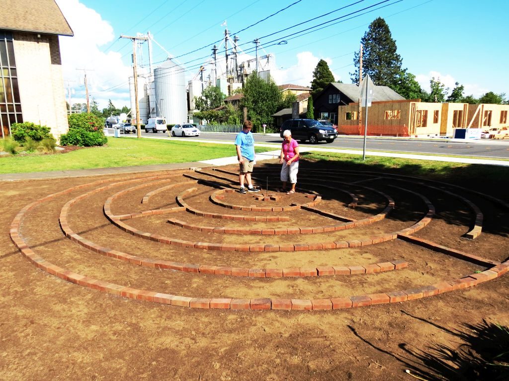 Bobby Harkleroad and a volunteer consider their options while working on Harkleroad's Eagle Scout project on Washington Street 2017-06-10