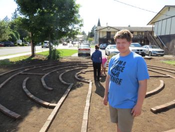 Bobby Harkleroad pauses from working on his Eagle Scout project on Washington Street 2017-06-10