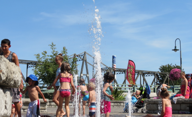 Kids playing in the fountain at Centennial Riverwalk Park in 90-degree weather (August 19, 2016). Photo: Whatcom News