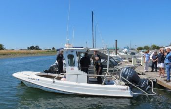 officials check out the boston whaler donated by p66 to wcfd17