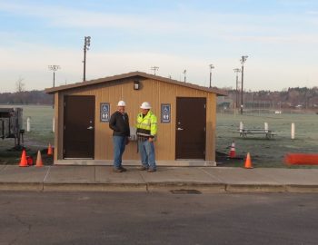 kevin and james are all smiles in front of the prefab public facility that was just set on the pad at star park 2017-12-14