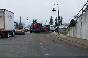 mini excavator toppled off trailer after striking rr bridge on main street 2018-02-21 photo warren vose