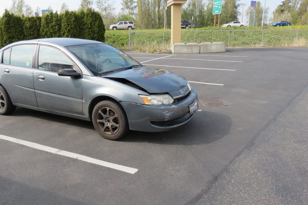 The Saturn involved in a crash in the 1700 block of Main Street sustained moderate front-end damage (April 27, 2018). Photo: Discover Ferndale