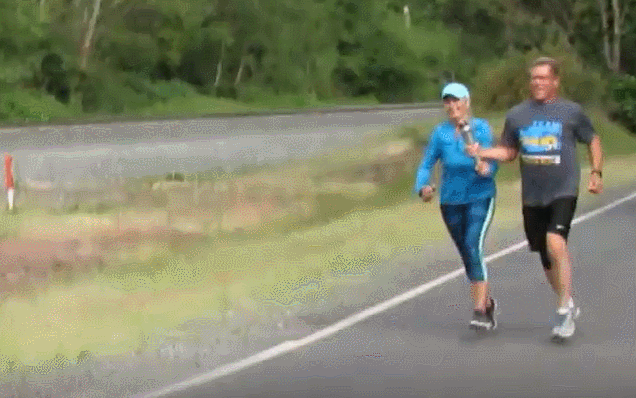 Ferndale Police Officer Mike Catrain and his wife, Chris, hand off the Special Olympics torch to a Bellingham Police officer on Portal Way at Brown Road (May 30, 2018). Photo: Whatcom News