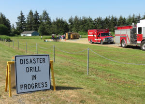 disaster drill in progress sign in front of yellow rhino scene