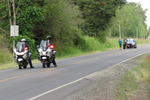 fpd officer mike catrain and his wife approach the hand off pt at brown and portal