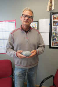 mayor jon mutchler shares one of the well worn rocks brought up during the drilling of the 2nd pw shop well 2018-05-03