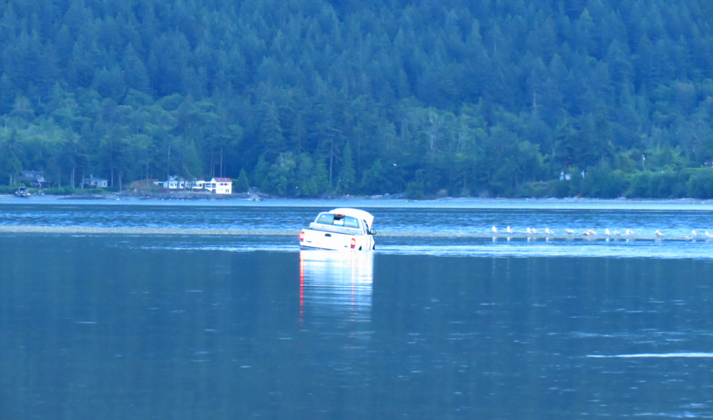 pickup truck stranded on land bridge to Portage Island 2018-06-07