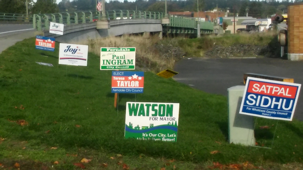 political signs on public right-of-way along Main Street east of Pioneer Bridge 2015-10-05