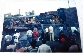 crowd watches as workers remove train cars from Ferndale ConTel building 2 1979-09 photo Ron Willand