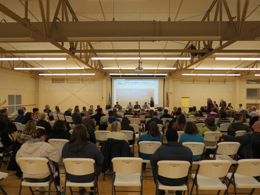 panel members and attendees take their seats just prior to a school bond town hall meeting 2018-11-15