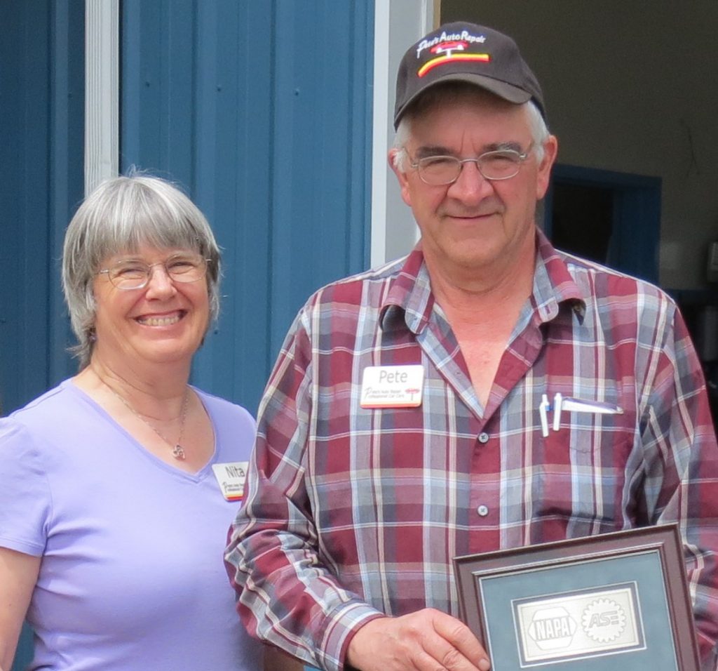 Pete, Jr. and Nita Harksell pose with one of the NAPA/ASE awards they have received while running Pete's Auto Repair (June 27, 2017). Photo: Whatcom News