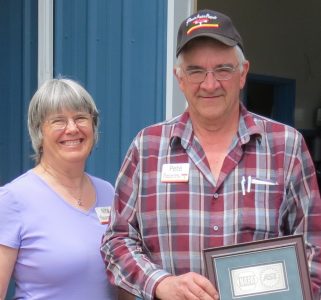 Pete, Jr. and Nita Harksell pose with one of the NAPA/ASE awards they have received while running Pete's Auto Repair (June 27, 2017). Photo: My Ferndale News