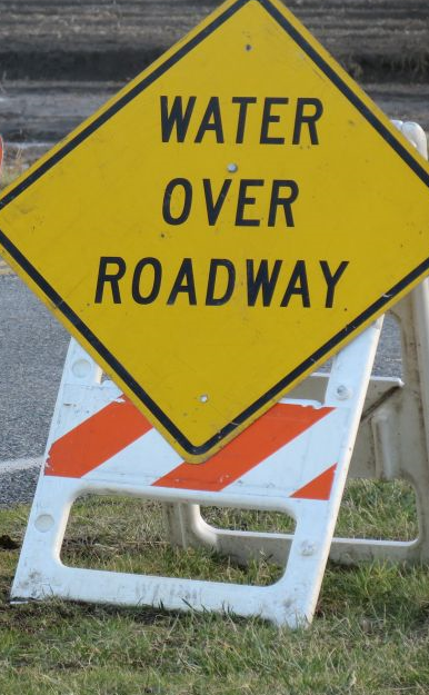 water over roadway sign