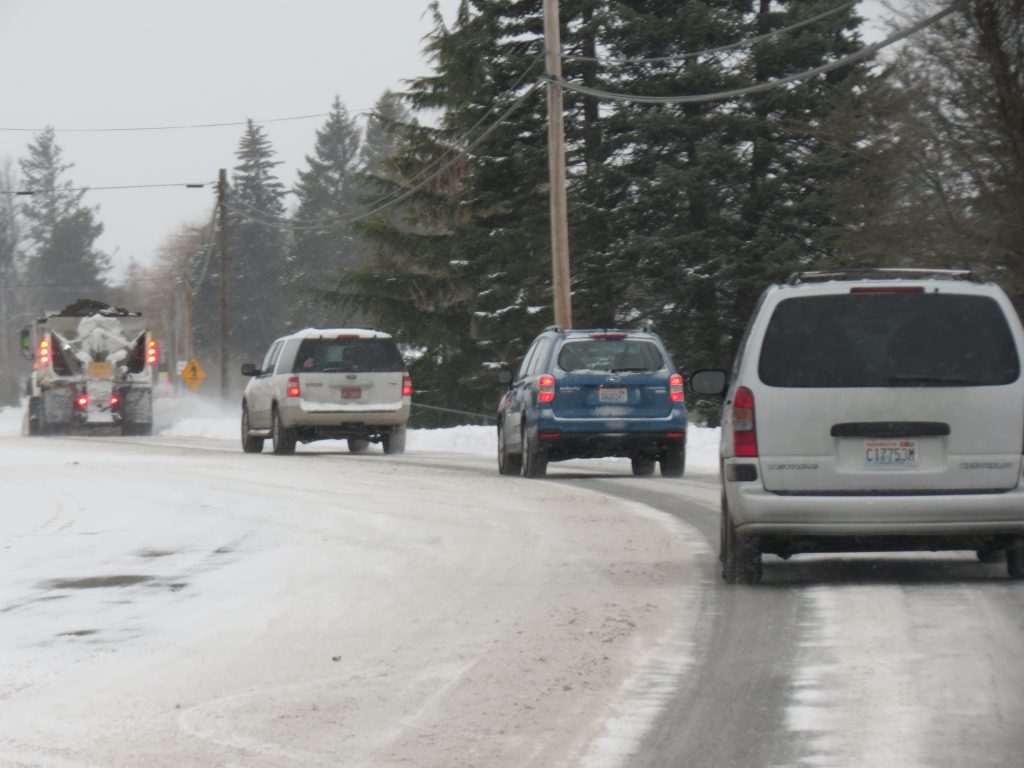 Traffic follows a City of Ferndale snowplow on Vista Drive (February 11, 2019). Photo: Whatcom News