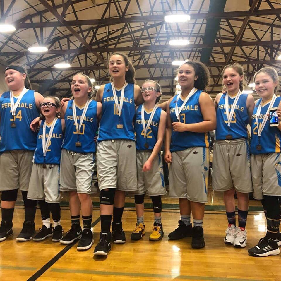Ferndale Girls Basketball Association 5th grade girls team pose together after winning 3rd place at the state tournament at Warehouse Athletic Facility in Spokane (March 17, 2019). Photo credit: Mandy Mills