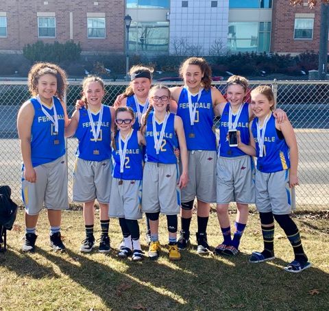 Ferndale Girls Basketball Association 5th grade girls team pose together after winning 3rd place at the state tournament outside the Warehouse Athletic Facility in Spokane (March 17, 2019). Photo credit: Mandy Mills 