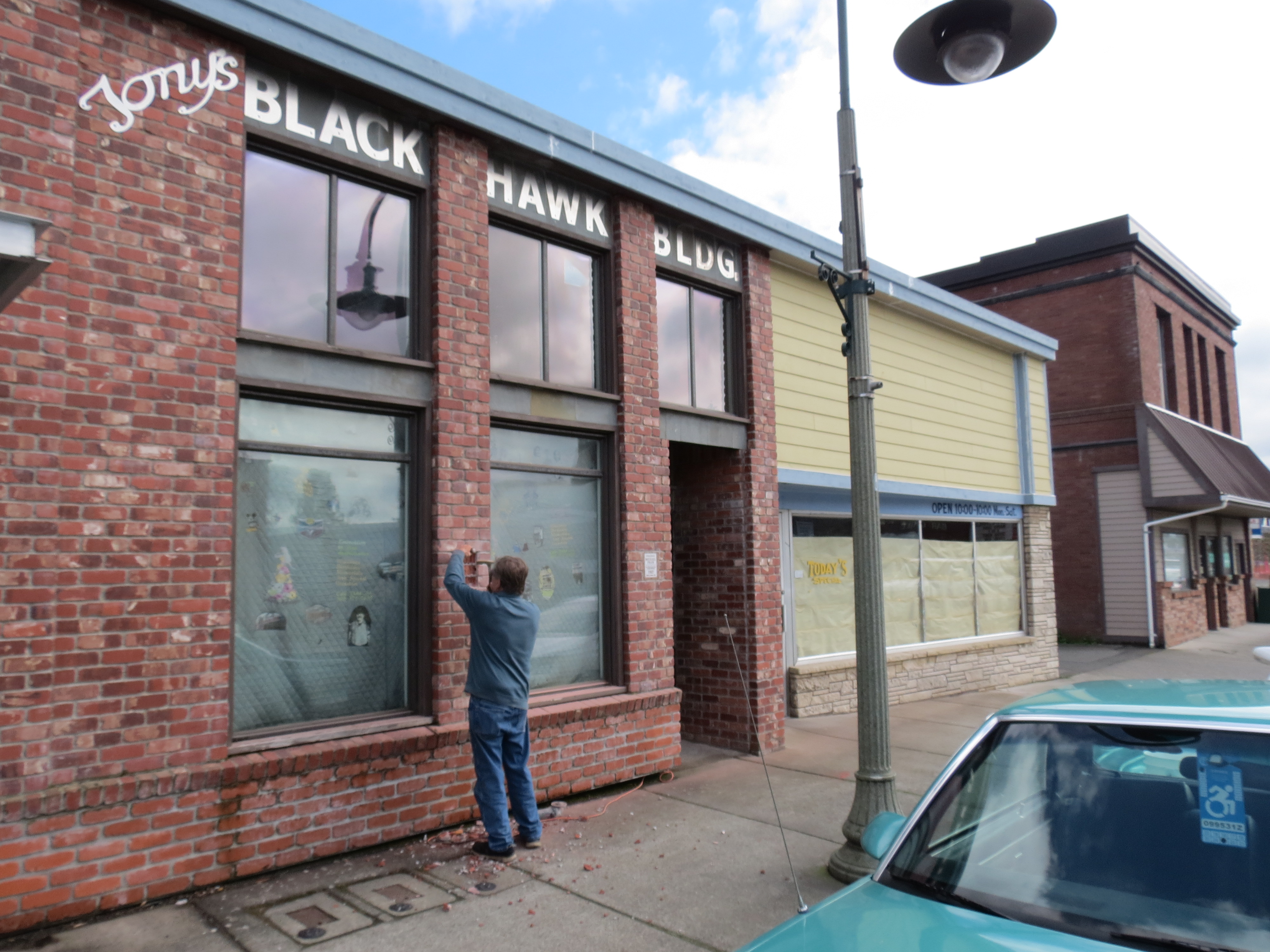 A contractor works on the fornt exterior brickwork during building renovations. (April 12, 2019). Photo: My Ferndale News
