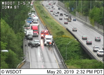 Scene of car vs semi truck crash in Bellingham on northbound I-5 at Whatcom Creek.