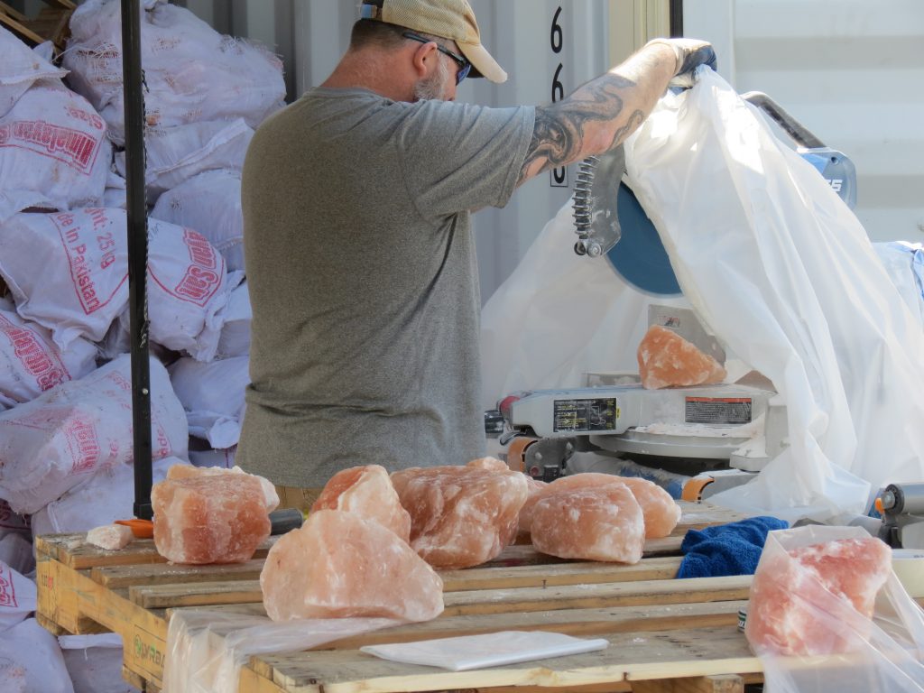 Adrian Hilde is seen cutting blocks of Himalayan salt for mounting on the walls of the Flow Motion Himalayan Salt Cave (May 3, 2019). Photo: My Ferndale News