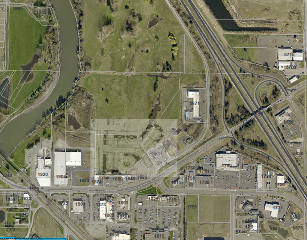 Riverside Place initial site plan superimposed over a satellite image.