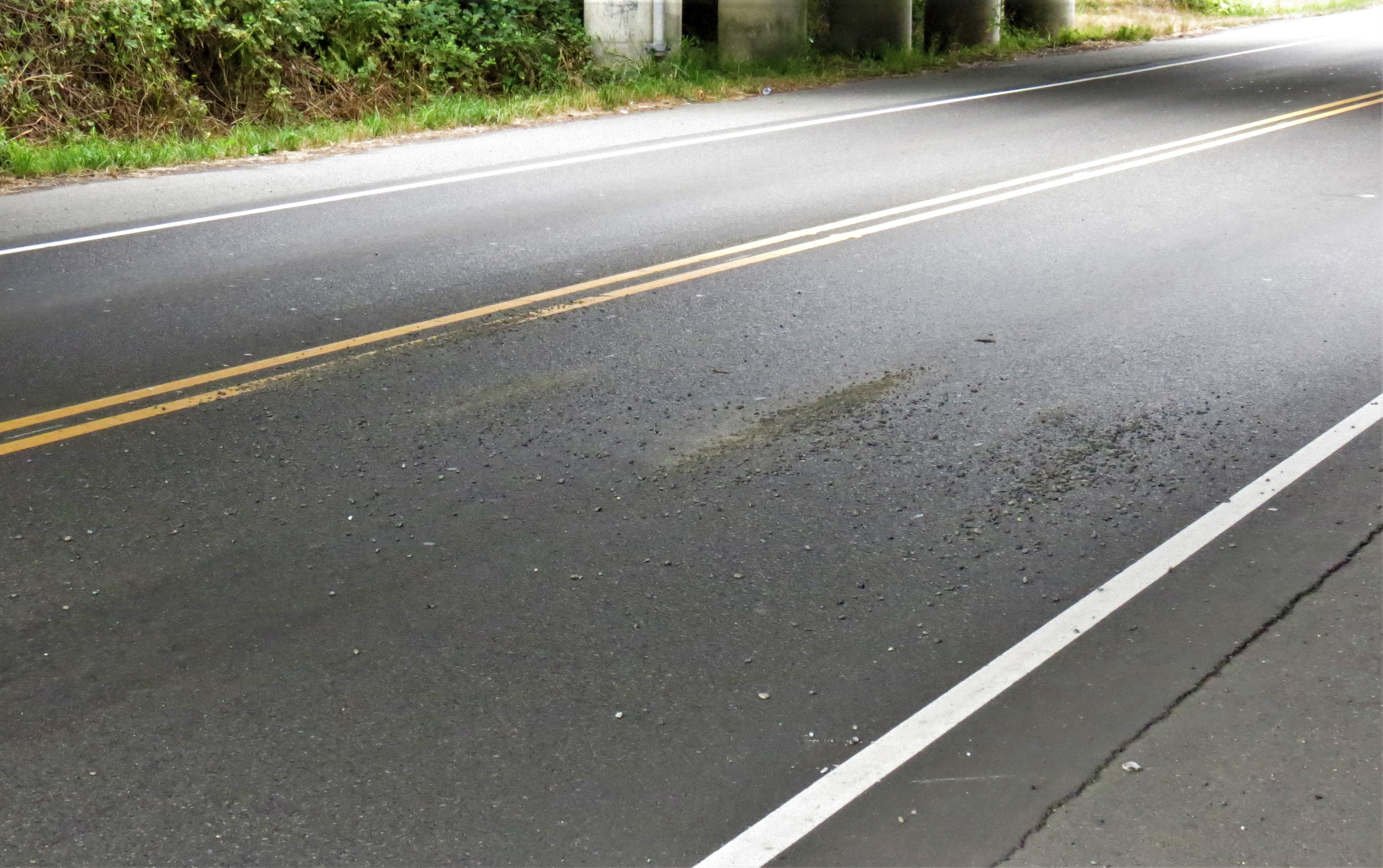 Debris visible on the roadway under the Portal Way underpass at I-5 after a semi truck hauling a backhoe that struck it (August 17, 2019). Photo: My Ferndale News