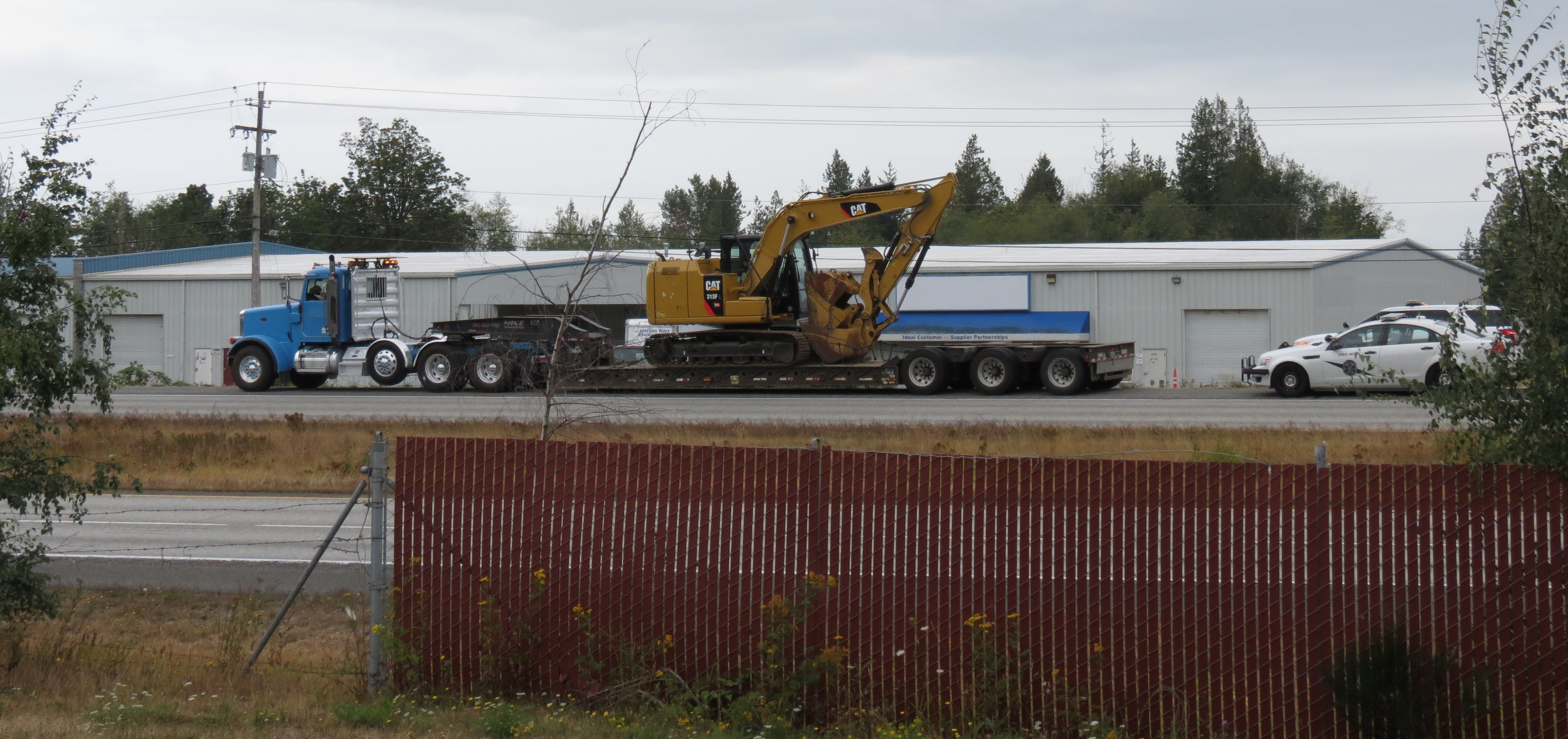 WSP made contact with a semi truck hauling a backhoe that damaged the Portal Way underpass at I-5 (August 17, 2019). Photo: My Ferndale News