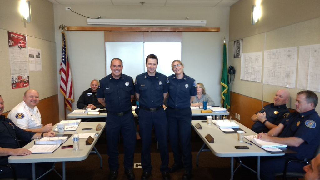 Newly certified paramedics (L to R) Ryan Pavitt, Wesley Segar and Jody Engels are recognized during a WCFD7 Commissioners Meeting,