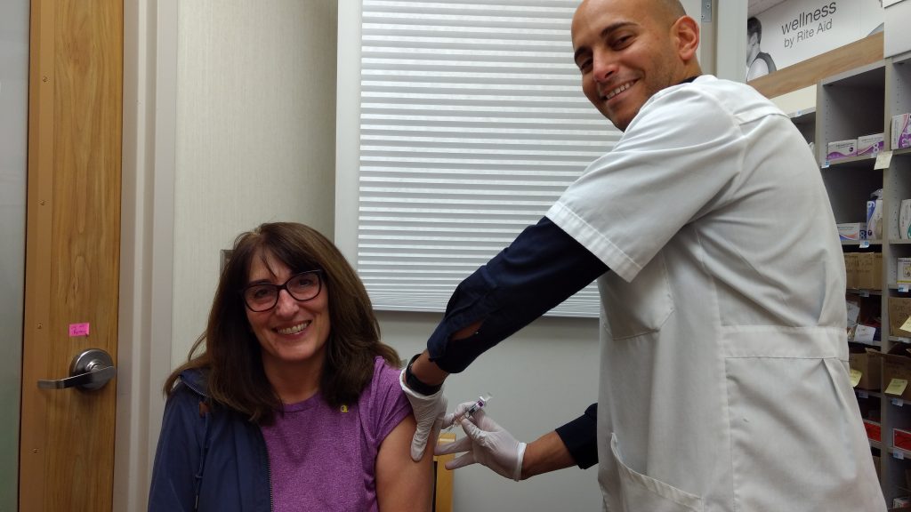 Rite Aid Pharmacist Karim Aziz administers a flu shot to Patty Beaulaurier (October 12, 2019). Photo: My Ferndale News