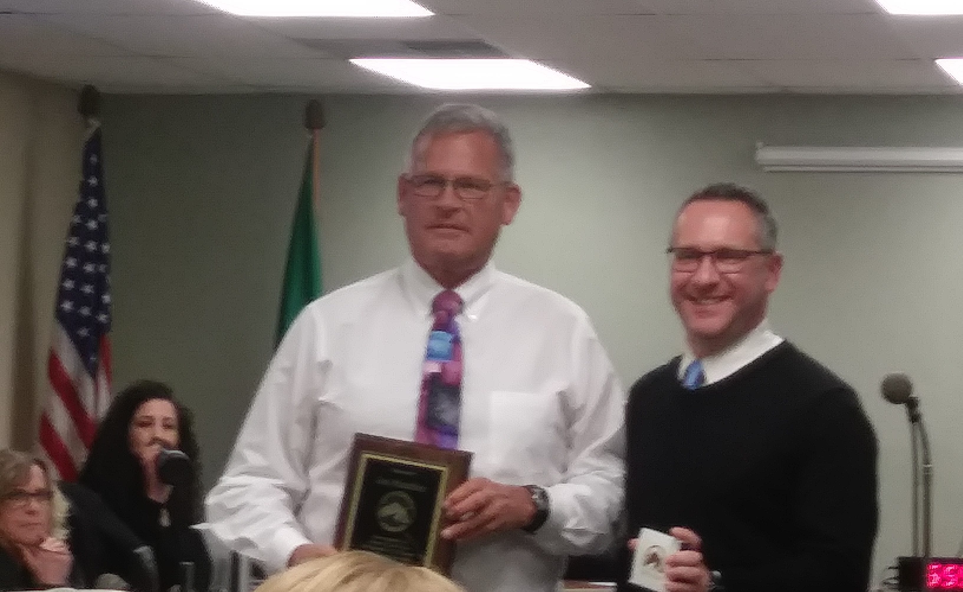 Mayor Jon Mutchler poses with a plaque recognizing his 4-year term with City Administrator Jori Burnett (December 16, 2019). Photo: Ben O'Brine