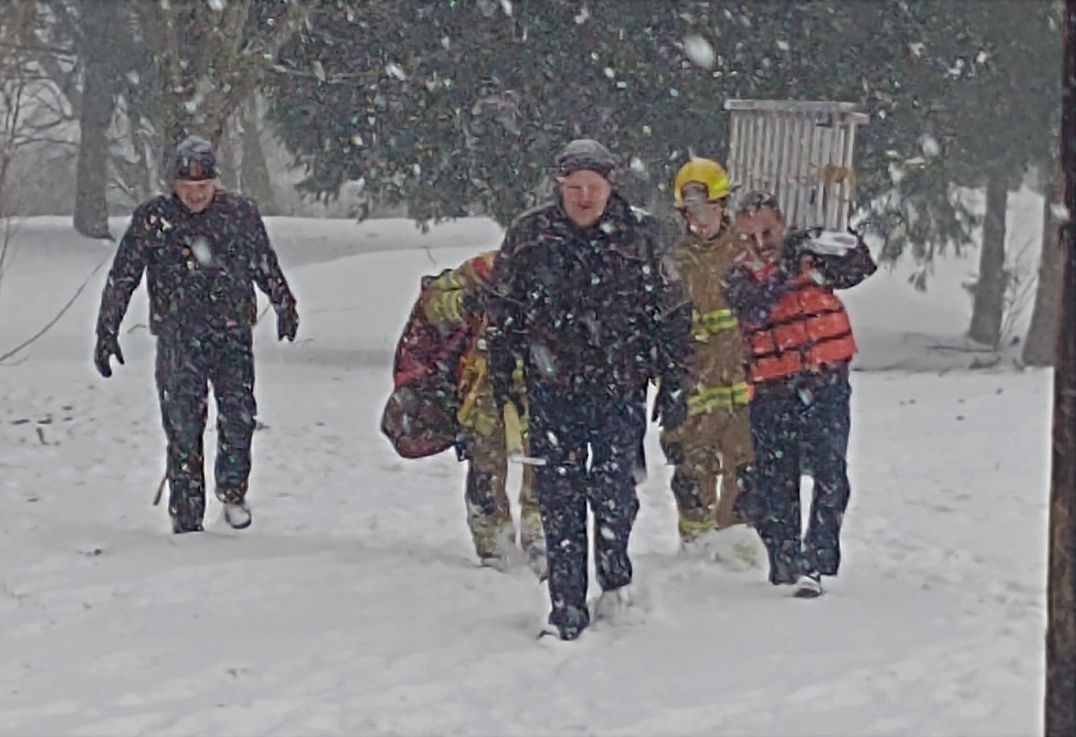 WCFD7 Fire Chief Larry Hoffman and other firefighters head back to their vehicles after rescuing a dog from the Nooksack River at VanderYacht Park (January 16, 2020). Photo: My Ferndale News