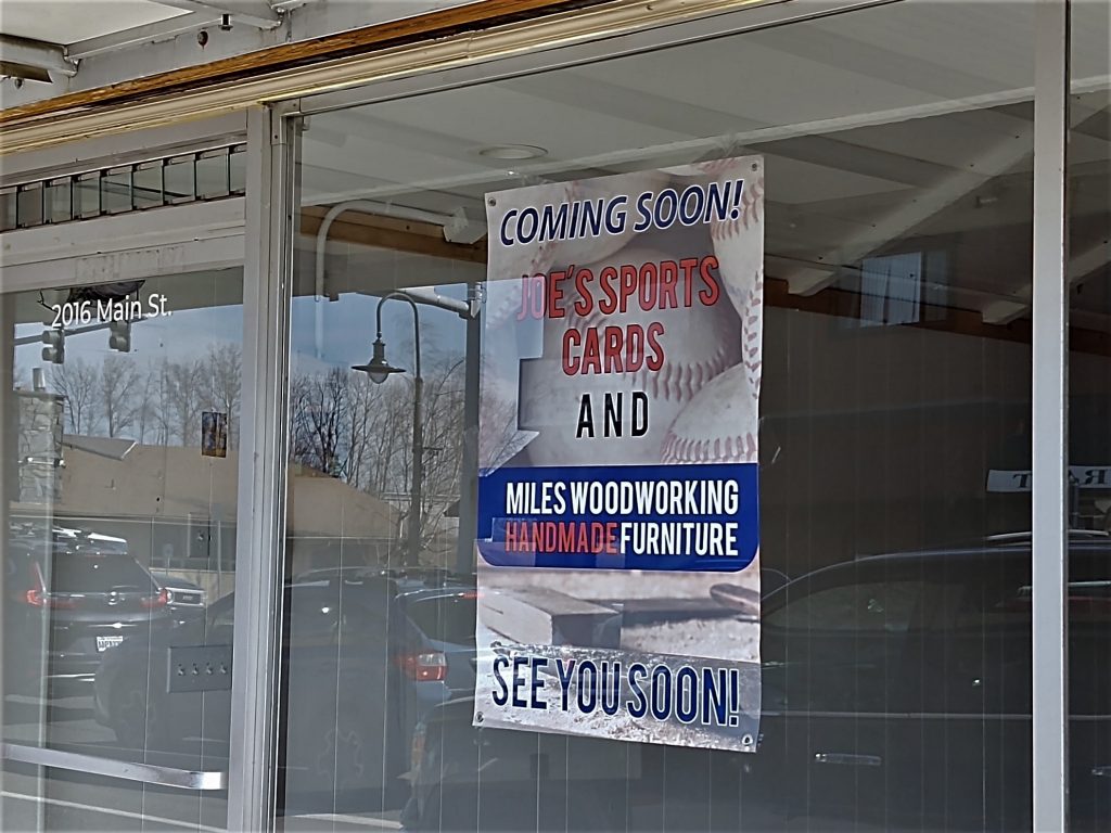 Opening soon poster announcing the anticipated arrival of Joe's Sports Cards and Miles Woodworking at 2016 Main Street (March 14, 2020). Photo: My Ferndale News