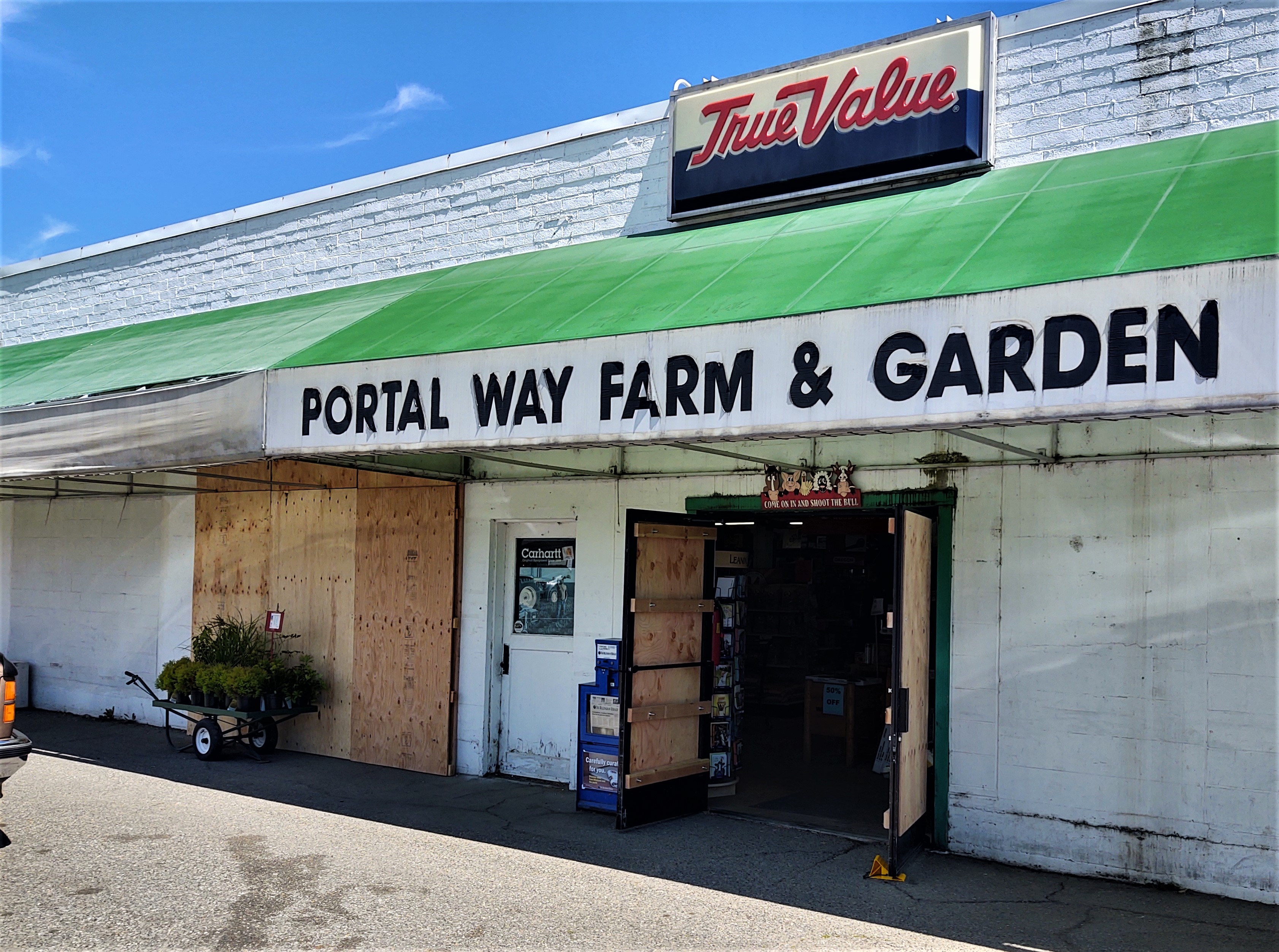 Portal Way Farm and Garden doors and windows with plywood repairs after front doors and a window were shattered (July 28, 2020). Photo: My Ferndale News
