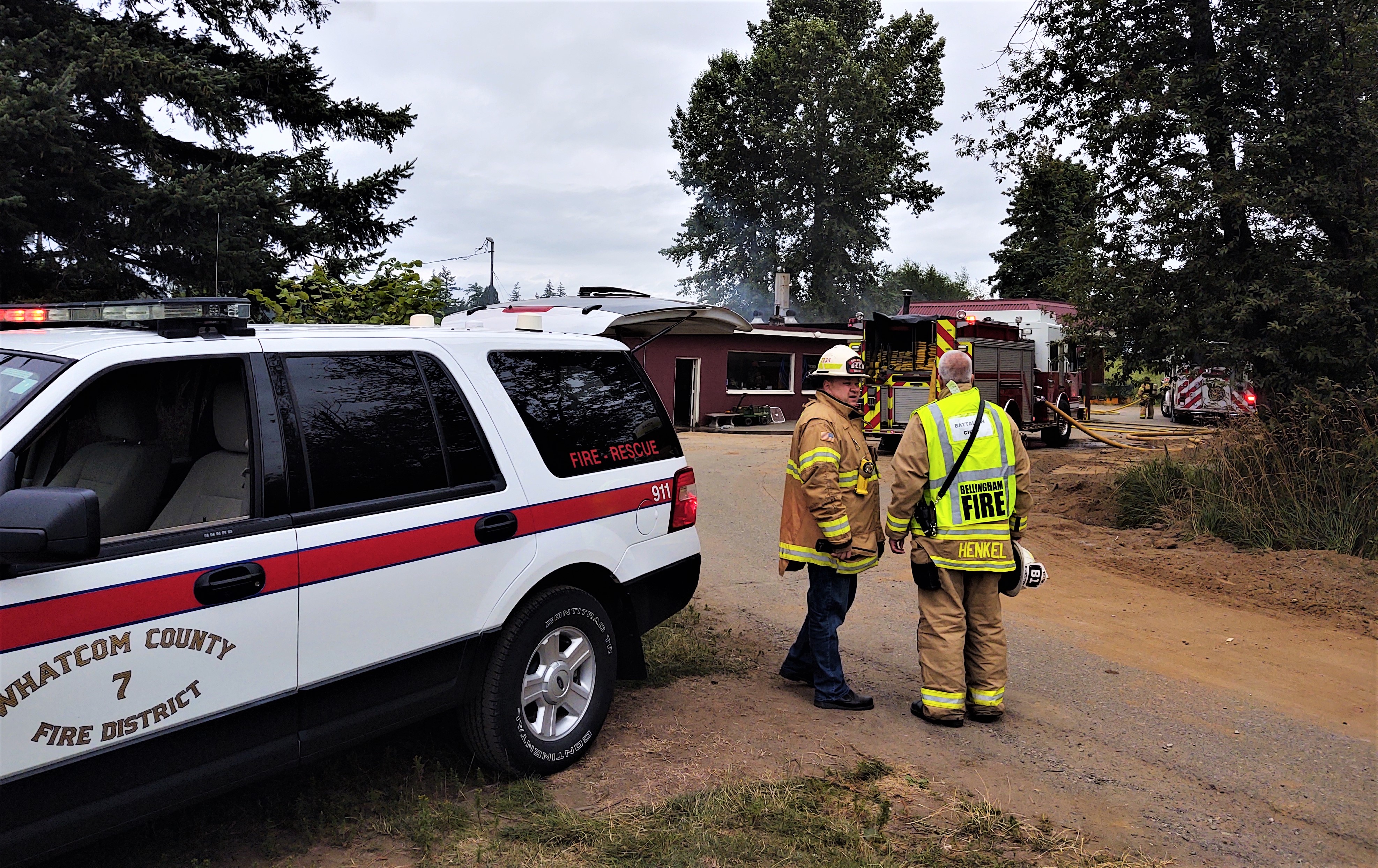 WCFD Division Chief Ben Boyko and Bellingham Fire Department Battalion Chief Charles Henkel discuss strategy for dealing with a fire in a building at Greenacres Cemetery (July 17, 2020). Photo: My Ferndale News