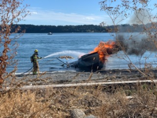 Boat fire on beach at Gooseberry Point (August 18, 2020). Photo courtesy of Barbara Craig